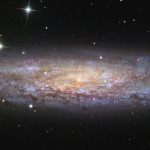 NGC 253, l'univers-île poussiéreuse