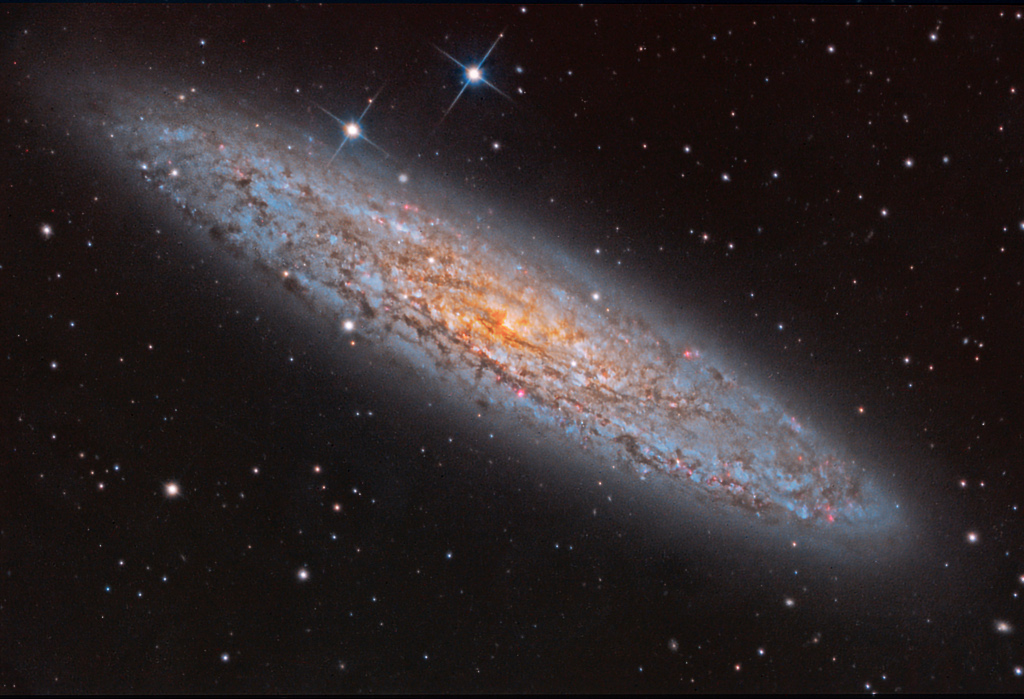 Poussière et lumière de NGC 253